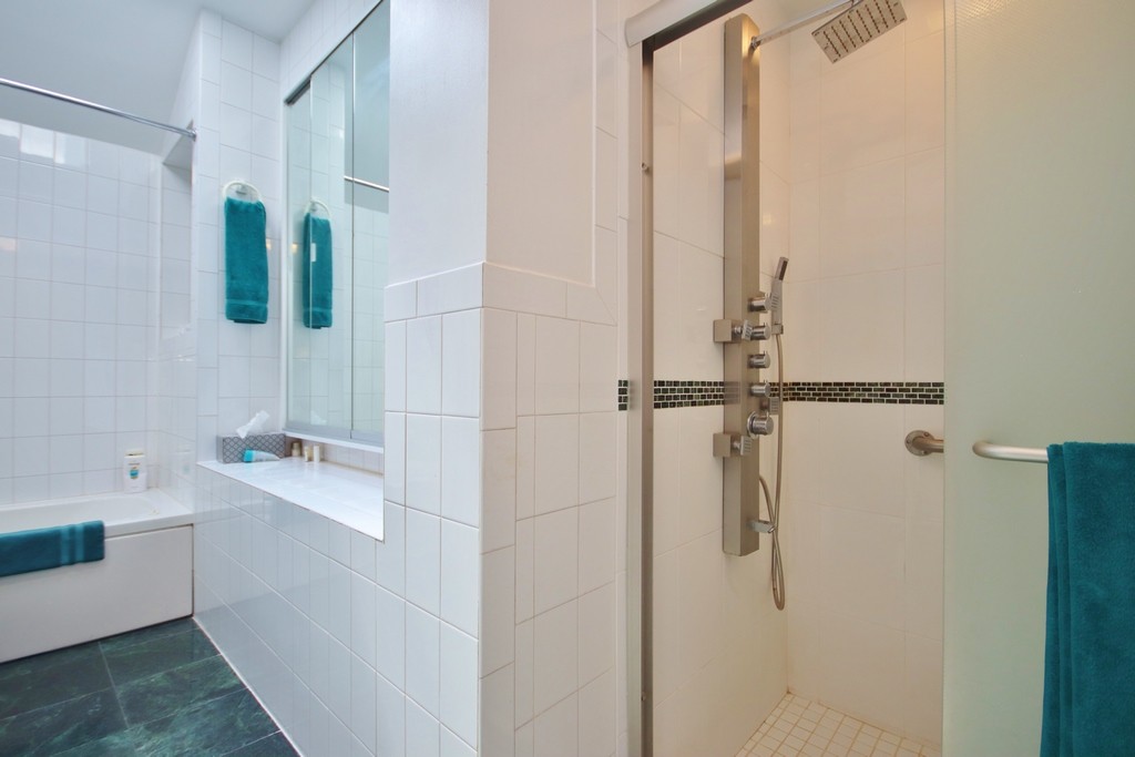 Bathtub and stall shower in Primary Bathroom