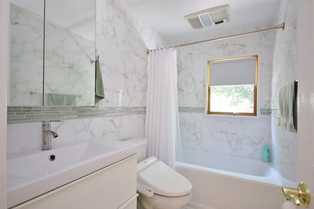 Updated Bathroom has bathtub with shower on Lower level