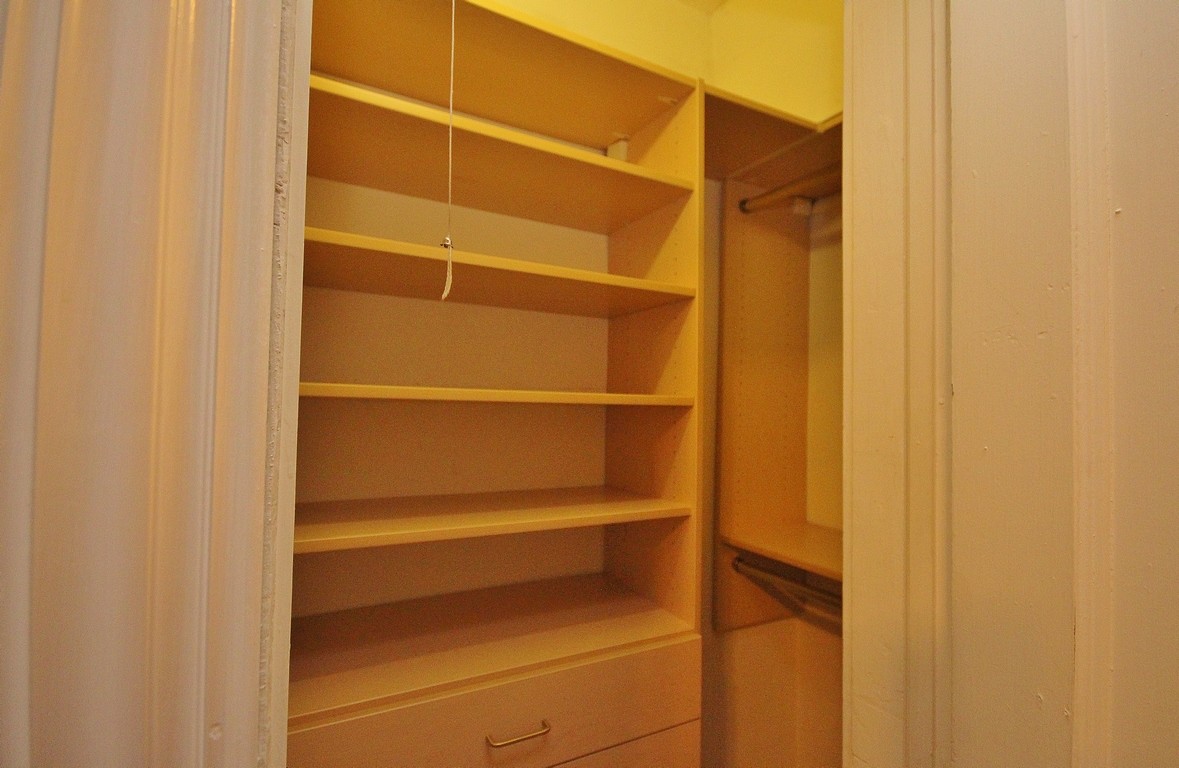 Spacious closet with built-in shelving